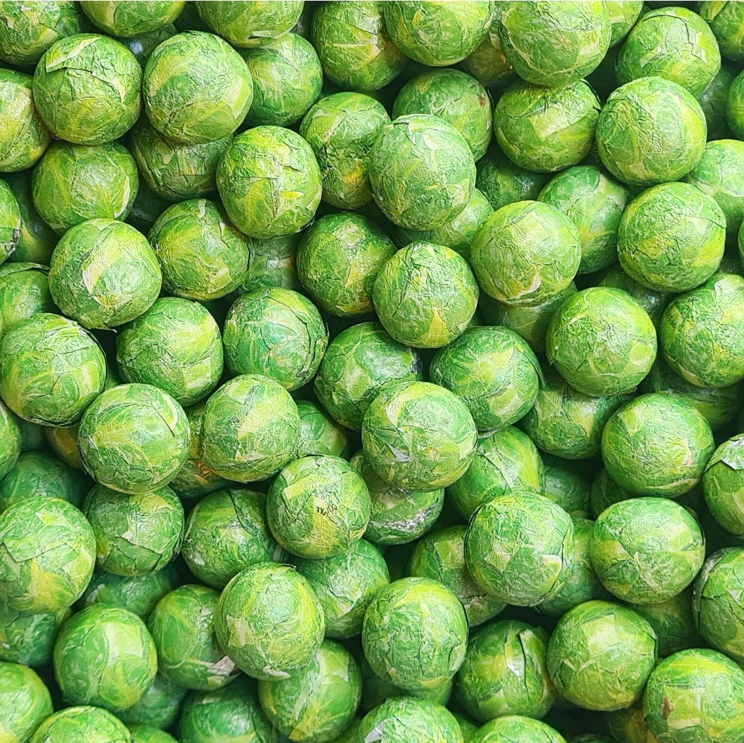 Milk Chocolate Sprouts are festive, bite-sized chocolate treats inspired by the classic Christmas vegetable. Smooth, creamy milk chocolate is shaped into small, sprout-like pieces, making them a fun and whimsical addition to holiday treats, stocking fillers, and festive sweet collections