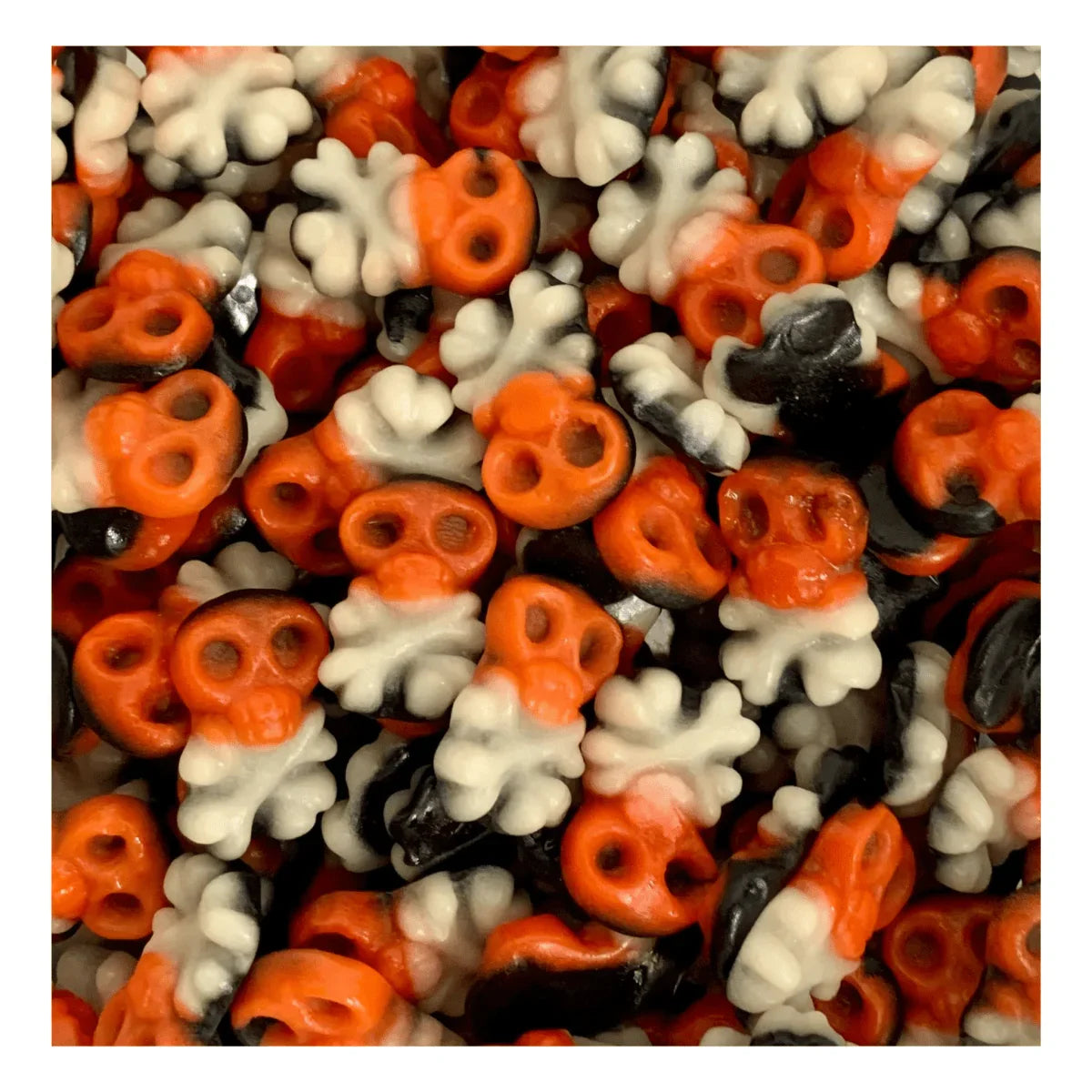Colorful Pirate Skulls jelly sweets by Gummy Galaxy, shaped like skulls with vibrant red, green, and yellow hues.